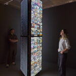 Two people view Meta Office “Behind the Screens of Amazon Mechanical Turks” in the SCHIRN exhibition The World Through AI.